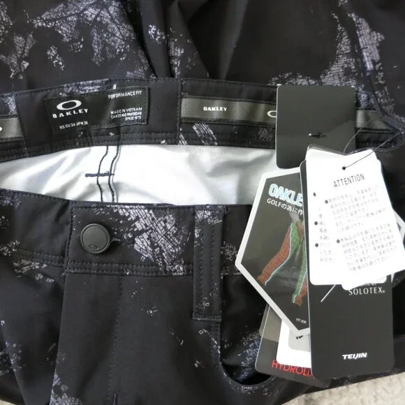 NWT OAKLEY SKULL GOLF Japan Black Splash Print 3D Slim TAPERED Stretch Pants 34